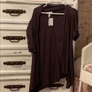 a brown shawl with sleeves